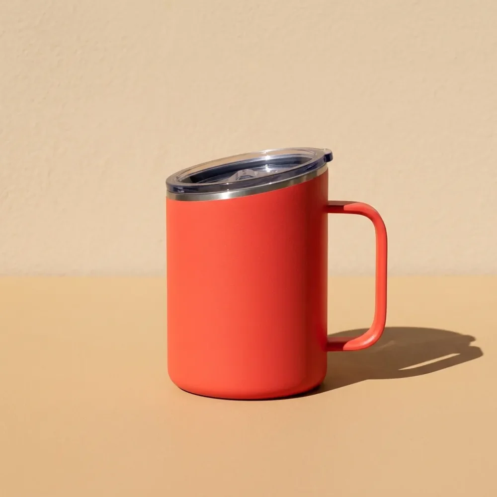 Tilt Handle Mug 14 oz, studio photo in midday sun